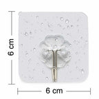 A single stainless steel adhesive hook holding a small bag.