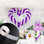 Using removable sticky dots to arrange a beautiful balloon arch for a wedding.