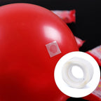 Close-up of double-sided adhesive glue dots on a roll, ready for use.