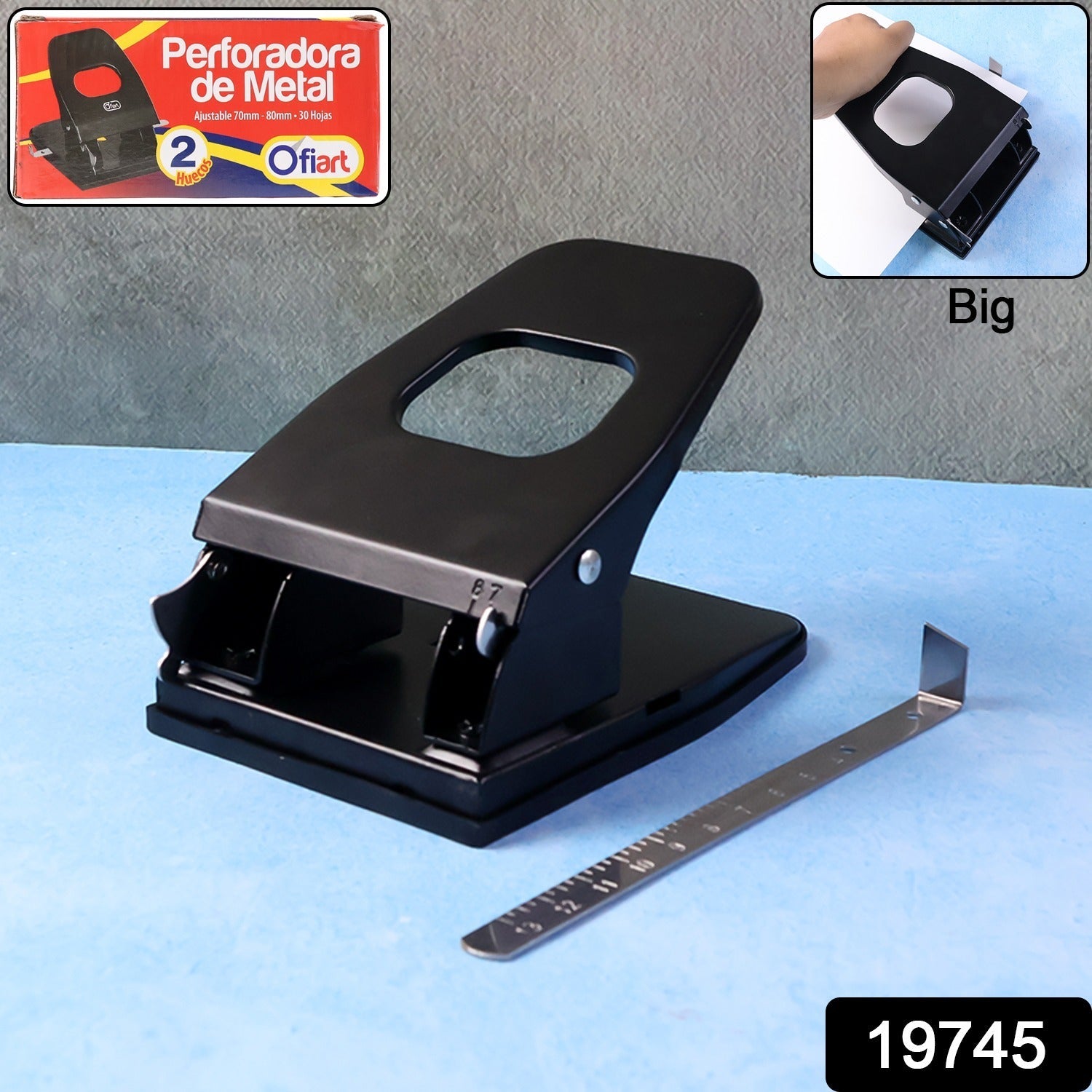 2-hole paper punch machine showing punched holes and ergonomic handle