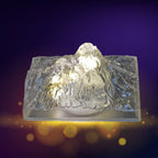 A hand demonstrating the simple one-touch control of the Iceberg Night Light.