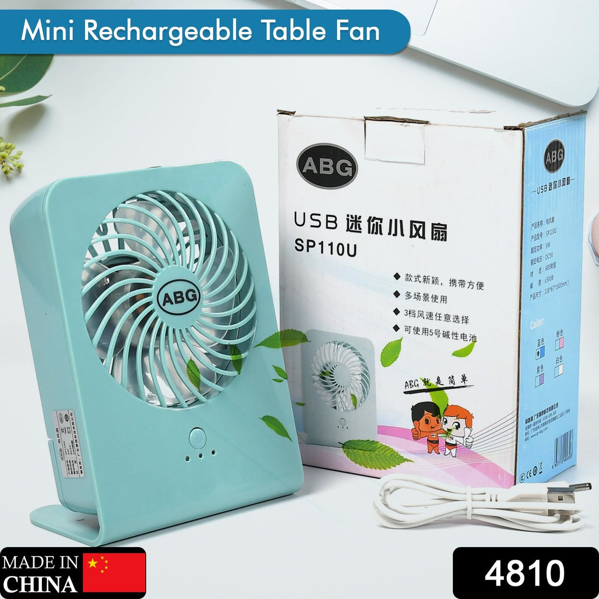 VoltDesk portable desk fan on a wooden desk, showcasing its compact size.