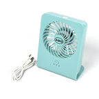 Close-up of the quiet four-blade design within the portable desk fan.