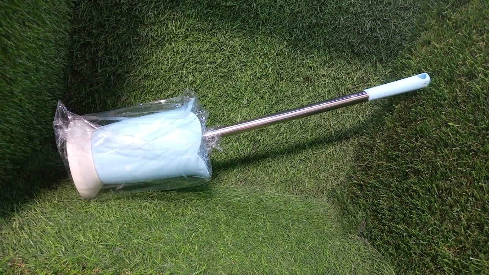 Complete toilet brush and holder set, essential for bathroom hygiene.