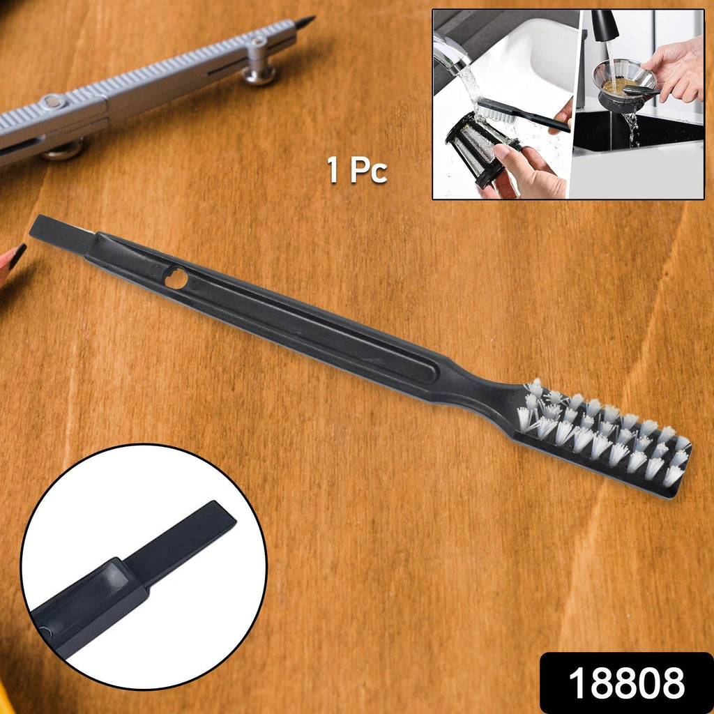 Ergonomic cleaning brush tackling hard-to-reach spots in a kitchen appliance.