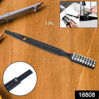 Ergonomic cleaning brush tackling hard-to-reach spots in a kitchen appliance.