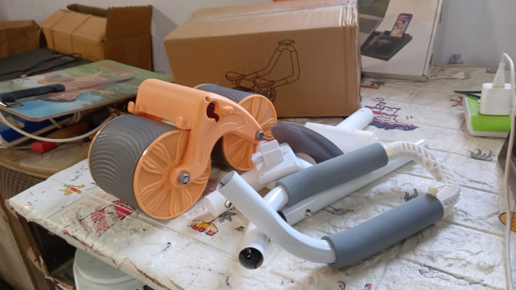 Compact and portable exercise wheel for home or gym use.