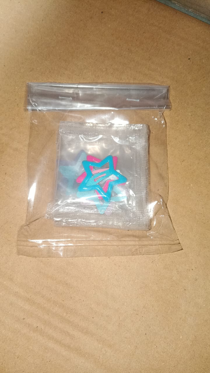 Packaging of metal star hair clips set showing brand details
