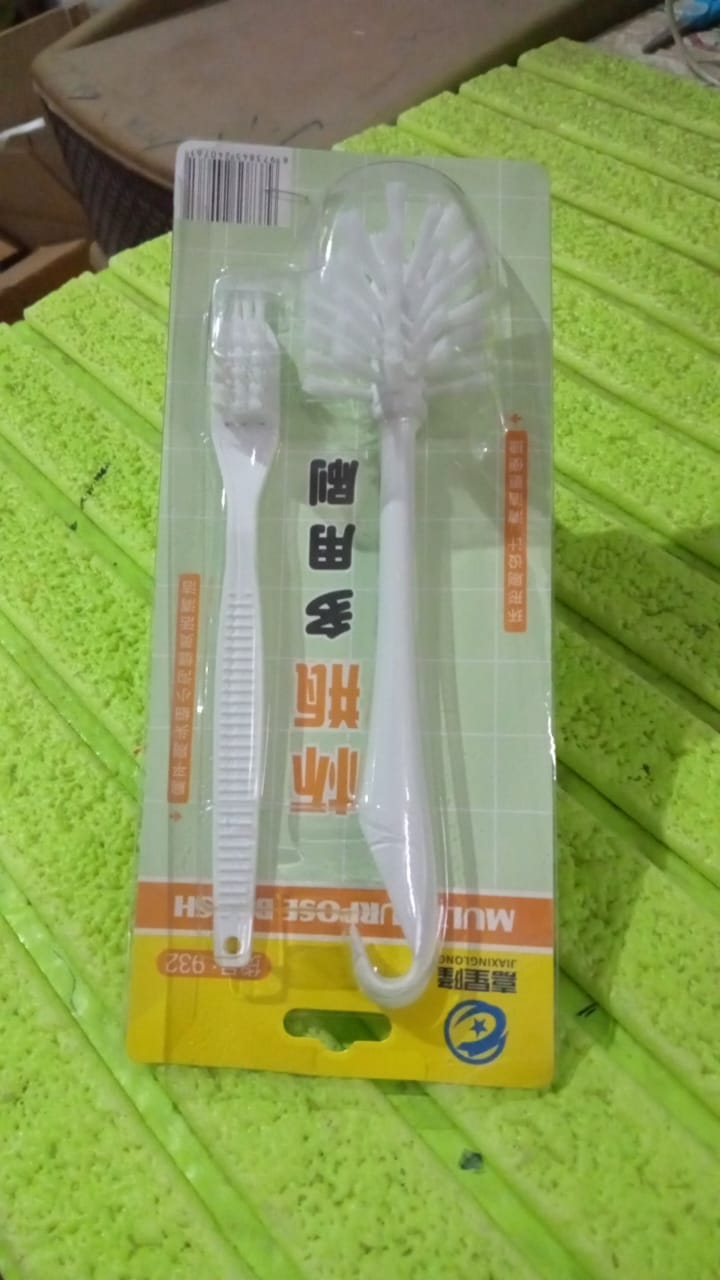 Set of cleaning brushes on a table surface
