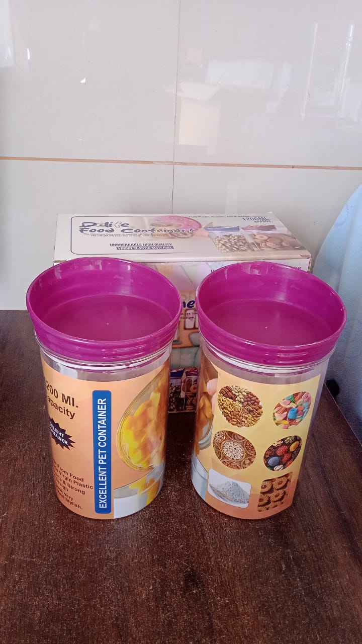 Group of CookAura plastic food containers in a kitchen setting, emphasizing organized storage.