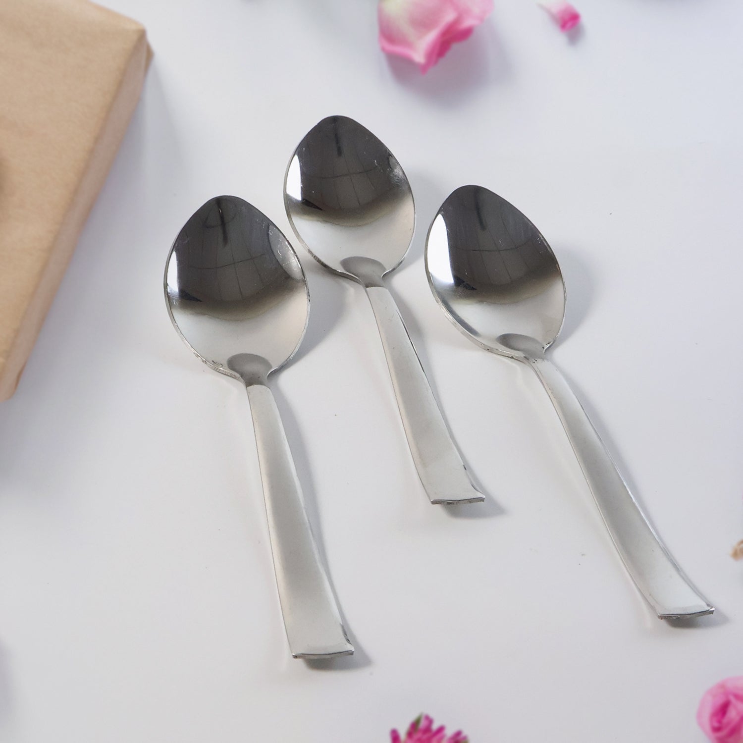 Close-up view of dining spoons showing contoured comfortable grip handles
