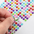 Variety of shaped crystal stickers ready for DIY creative projects and decoration.