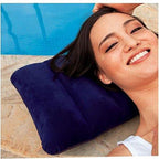 Velvet Travel Pillow in blue, deflated and folded for easy portability.