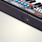 Side view showing various ports on the kids musical keyboard.