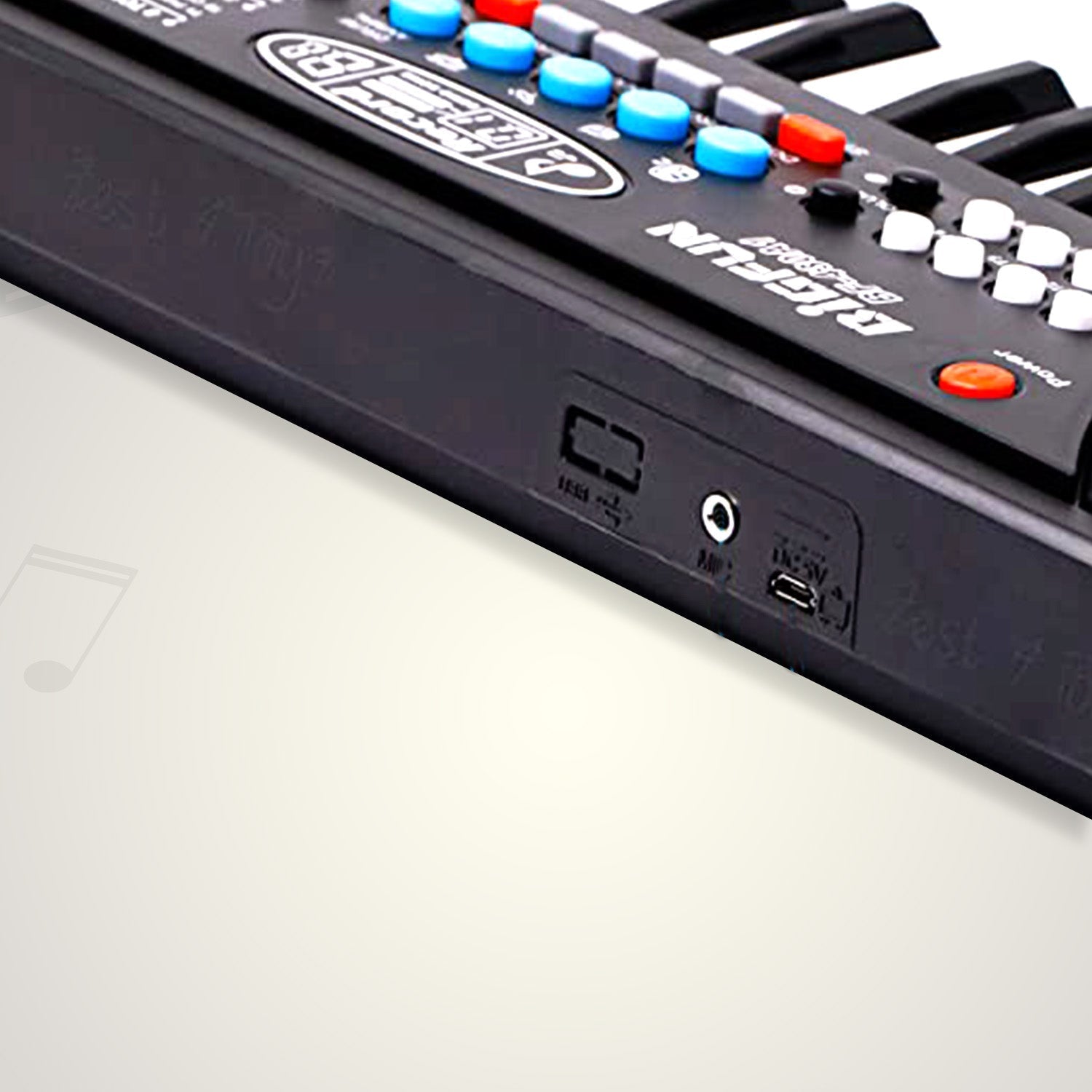 Side view showing various ports on the kids musical keyboard.