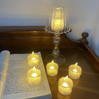 A close-up shot of multiple battery-operated flameless candles emitting a soft, warm glow.