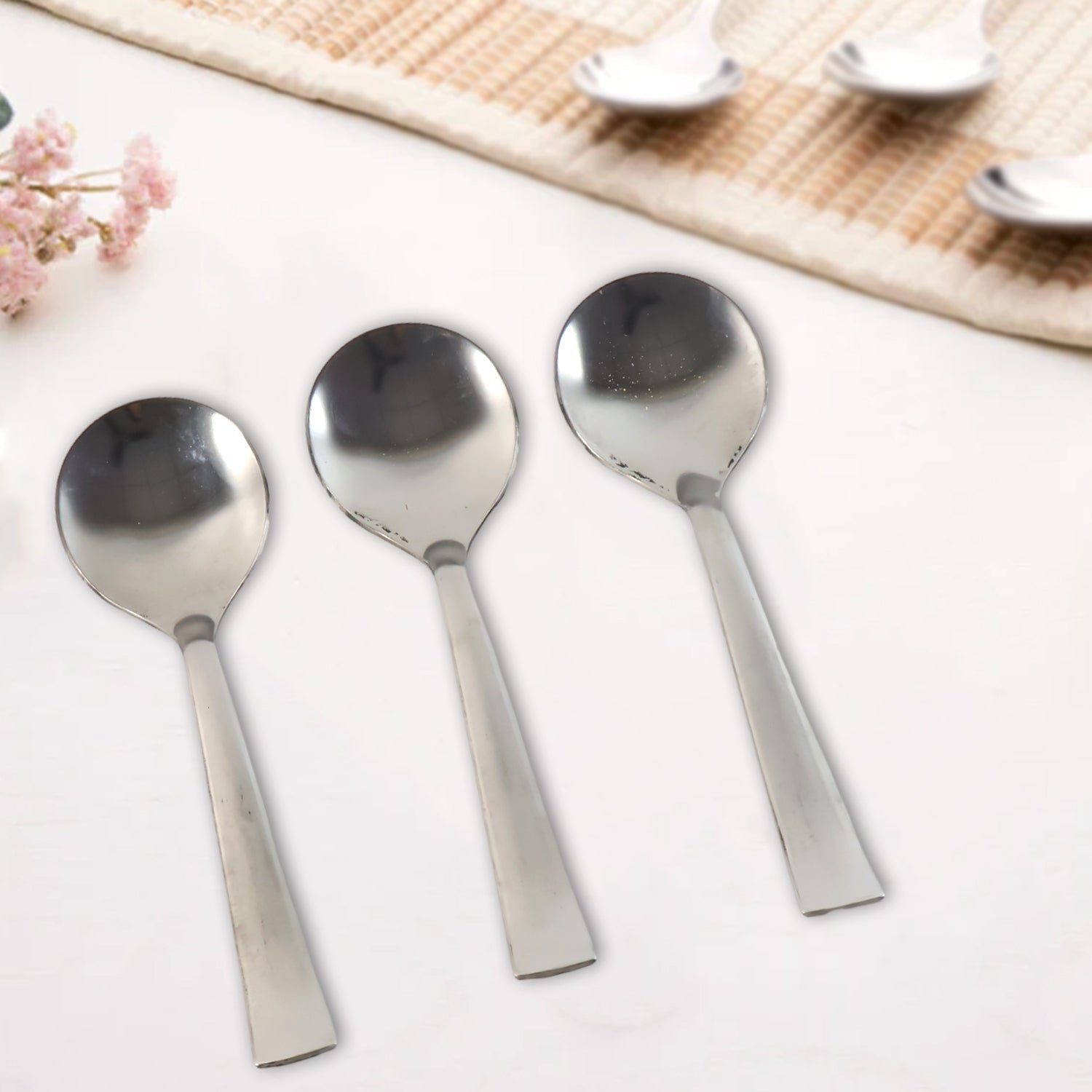 Dining spoons showing ergonomic handles and smooth oval bowls
