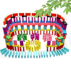 Artistic arrangement of 120 Pcs colorful wooden domino blocks on a surface.