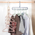 The multi-functional 9-hole hanger efficiently organizes various clothes inside a closet.