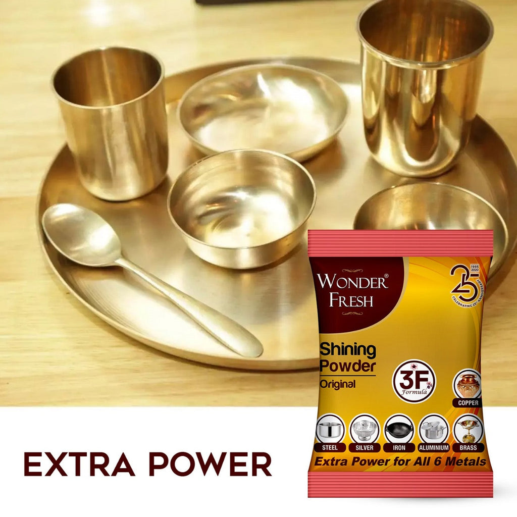 Shiny copper utensils after cleaning with Wonder Fresh Metal Polishing Powder.