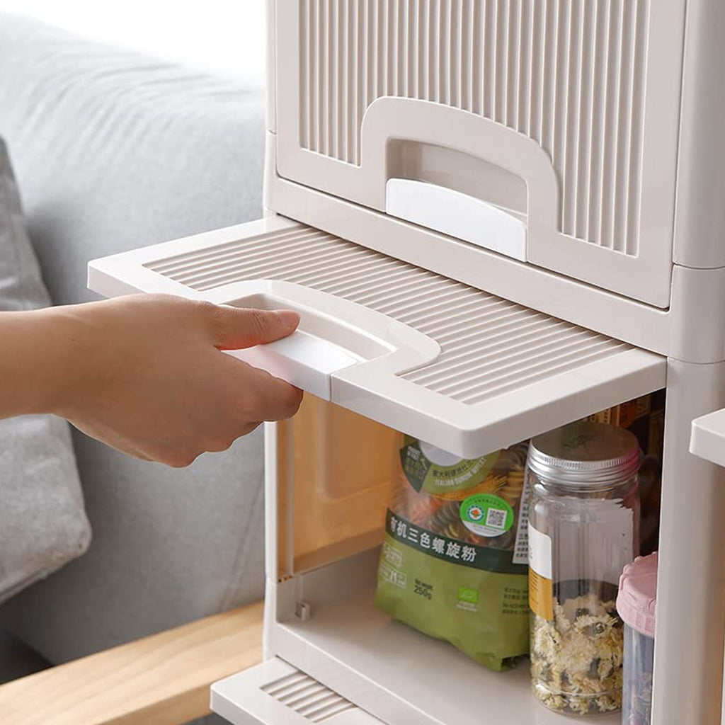 Close-up of ergonomic handles on the foldable storage cabinet's plastic drawers.