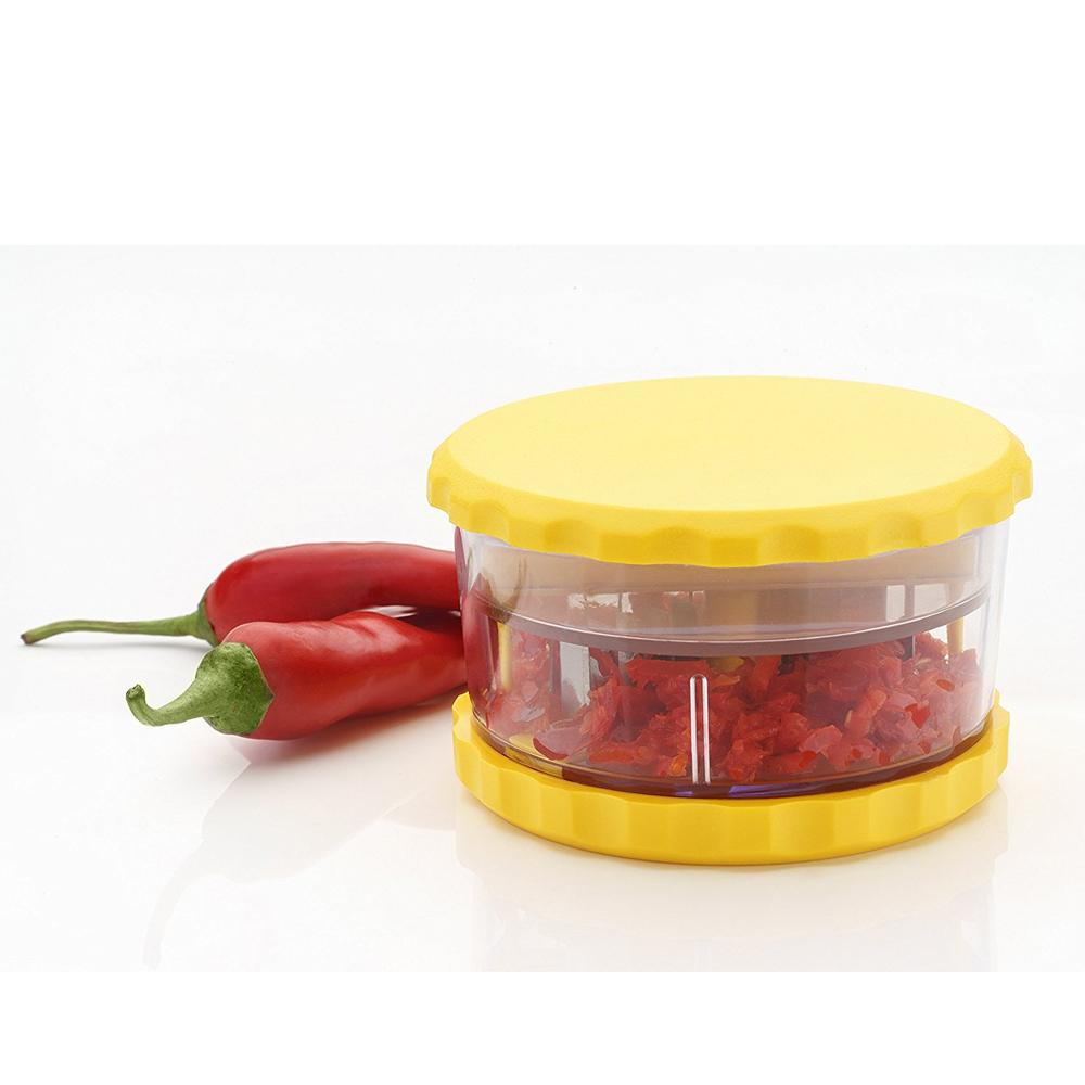 Versatile manual food processor, perfect for chopping garlic, ginger, and herbs.