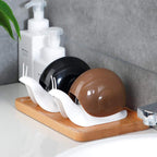 Empty snail shape liquid soap dispenser ready for refill.