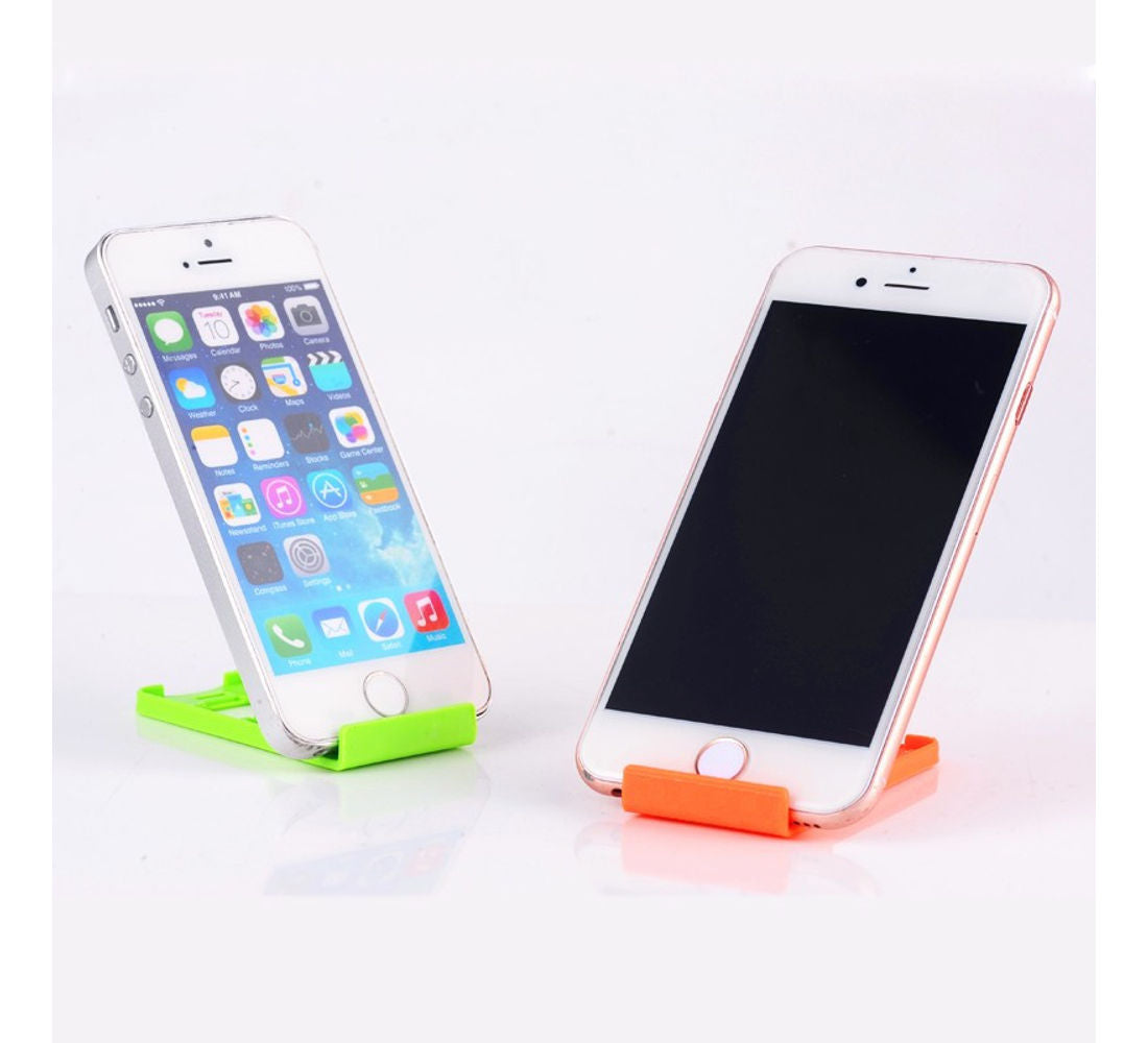 Universal foldable mobile phone stand portable for hands-free device use.