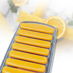 Hand demonstrating the easy push-out feature of the ice stick tray.