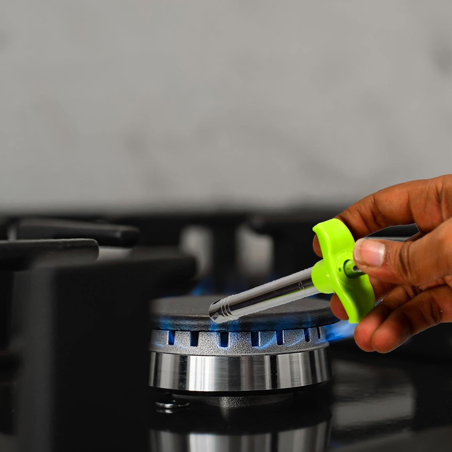 Detail of the Ganesh gas stove lighter with integrated knife and vegetable peeler.