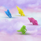 Three cute dinosaur erasers in red, blue, and green, arranged neatly on a surface.