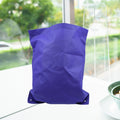 Reusable grocery bag in a neutral colour, folded for compact storage.