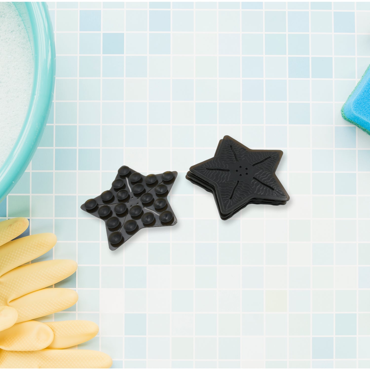 Happy child safely playing in a bath with star-shaped non-slip shower mats.