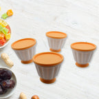 Four individual custard molds with lids displayed, perfect for chilled desserts.