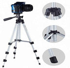 A Gambit camera tripod with a phone holder extended, ready for capturing photos.