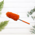 Person effectively cleaning venetian blinds with the adjustable microfiber duster.