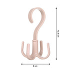 A hand holding the lightweight and portable 360-degree rotatable purse hanger hook.