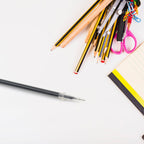 A hand demonstrating the smooth writing experience with an InkGlow black pen refill.