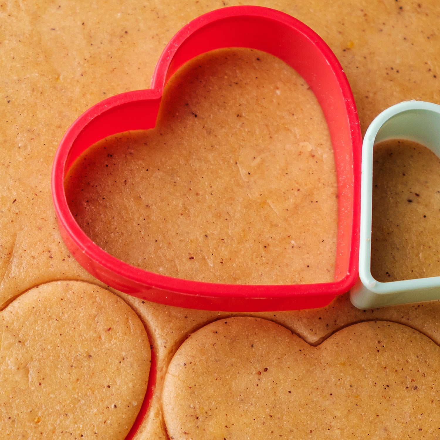 Plastic cookie cutters in various shapes, perfect for creative baking projects.