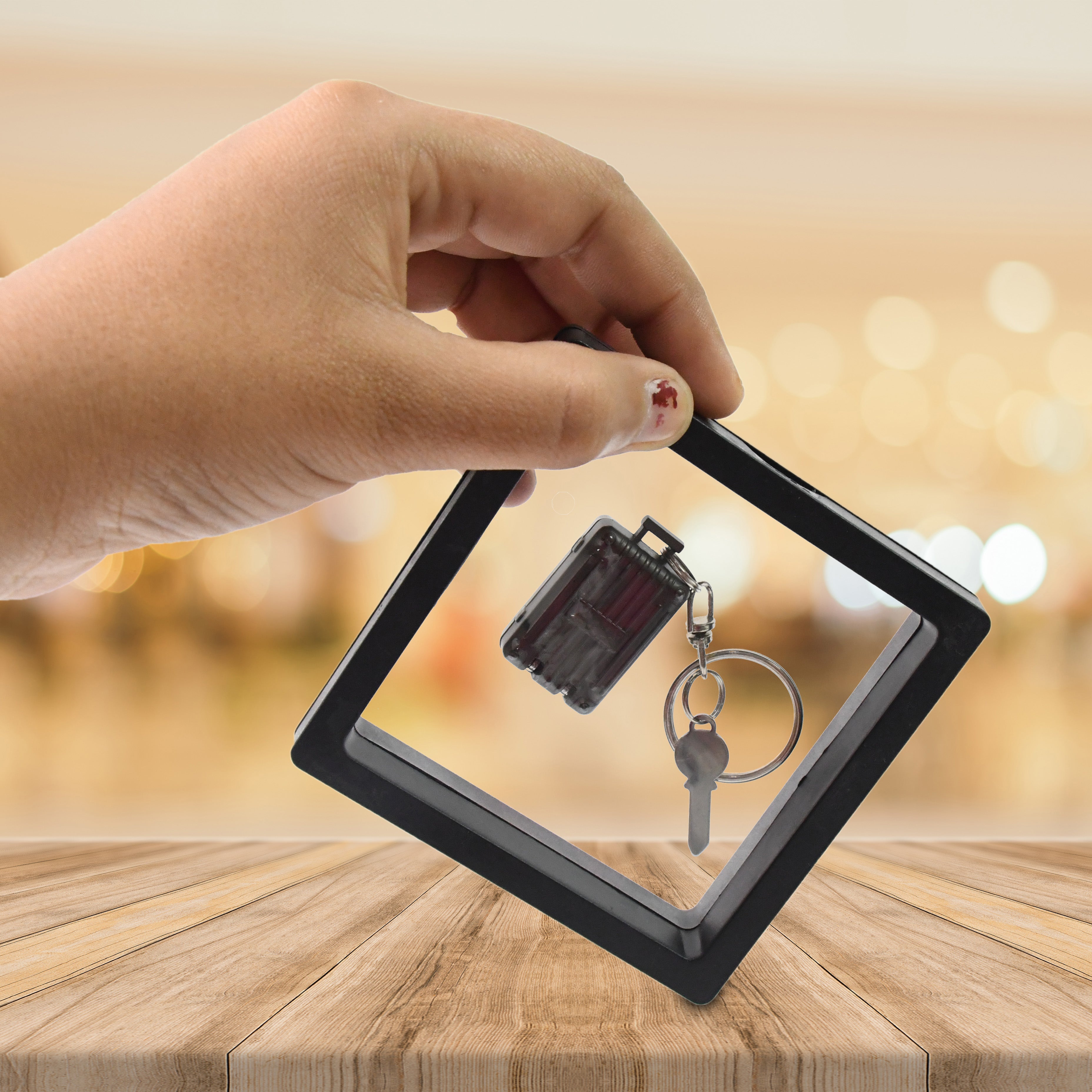 Portable nail clipper keychain with 3D floating frame display case by AuriGlam