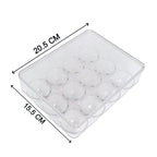 Multiple Organivo egg storage boxes stacked neatly inside a fridge.