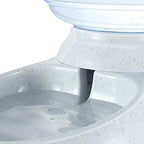 Angled view of the automatic pet water and food dispenser with its integrated food bowl.