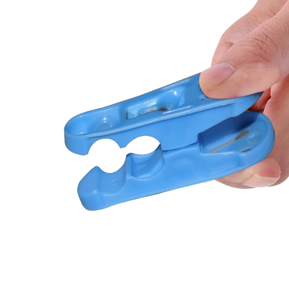 Lightweight plastic clothespins keeping clothes secure on a line.