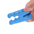 Lightweight plastic clothespins keeping clothes secure on a line.