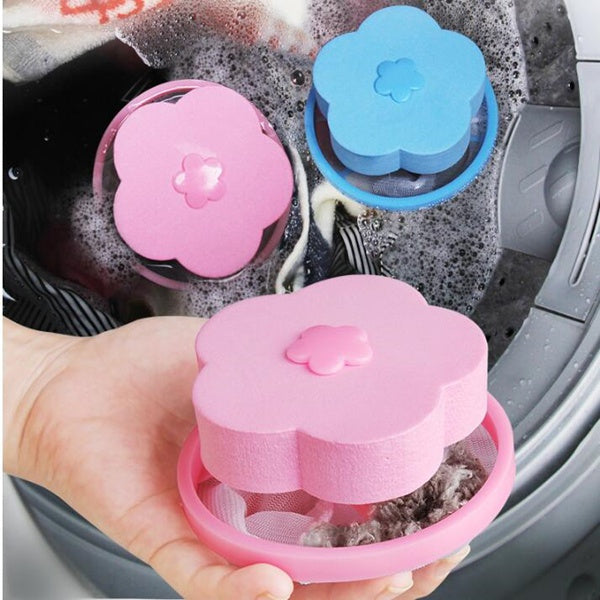 Floating washing machine lint catcher with a pink flower detail.