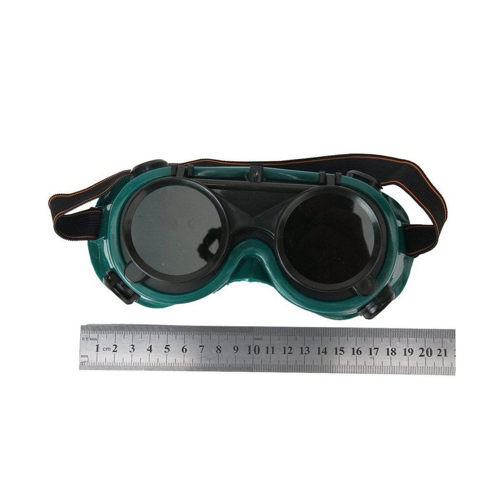 Dark green welding goggles with the outer colored lens flipped up for grinding or inspection.