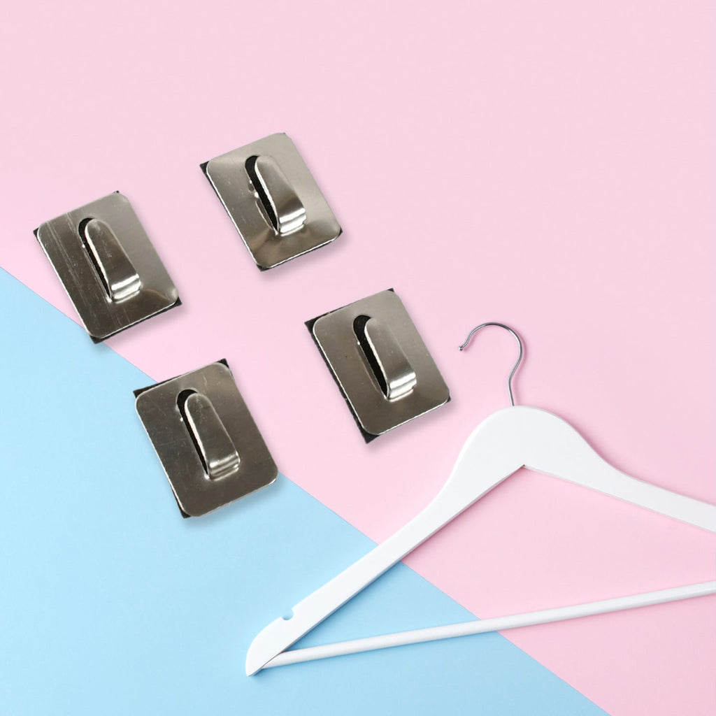 Reusable self-adhesive hooks easily repositioned on a smooth wall surface.