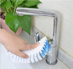 Flexible cleaning brush positioned to clean a bathroom faucet.
