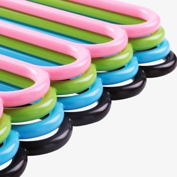 Detail of the non-slip arms on the multi-layered plastic clothes hanger.