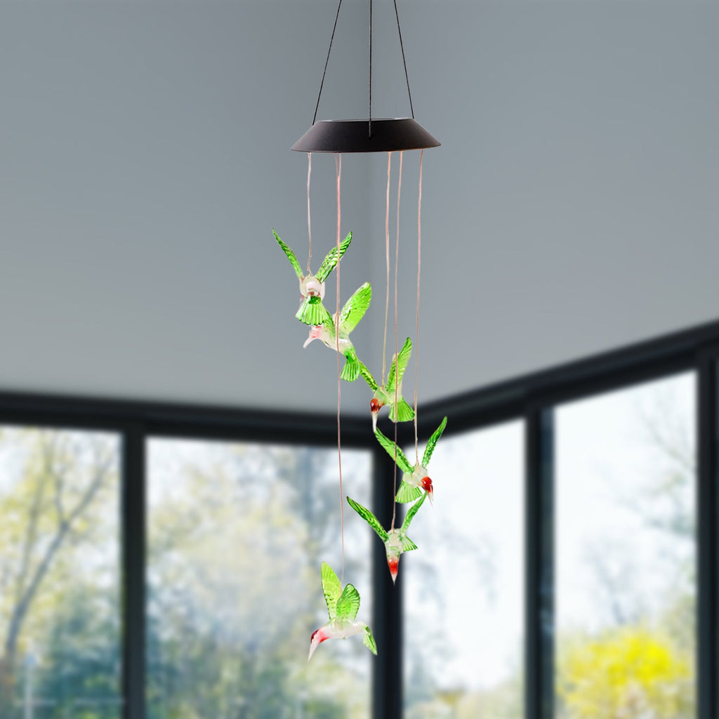 Multicolor LED glowing hummingbird wind chime shining at night